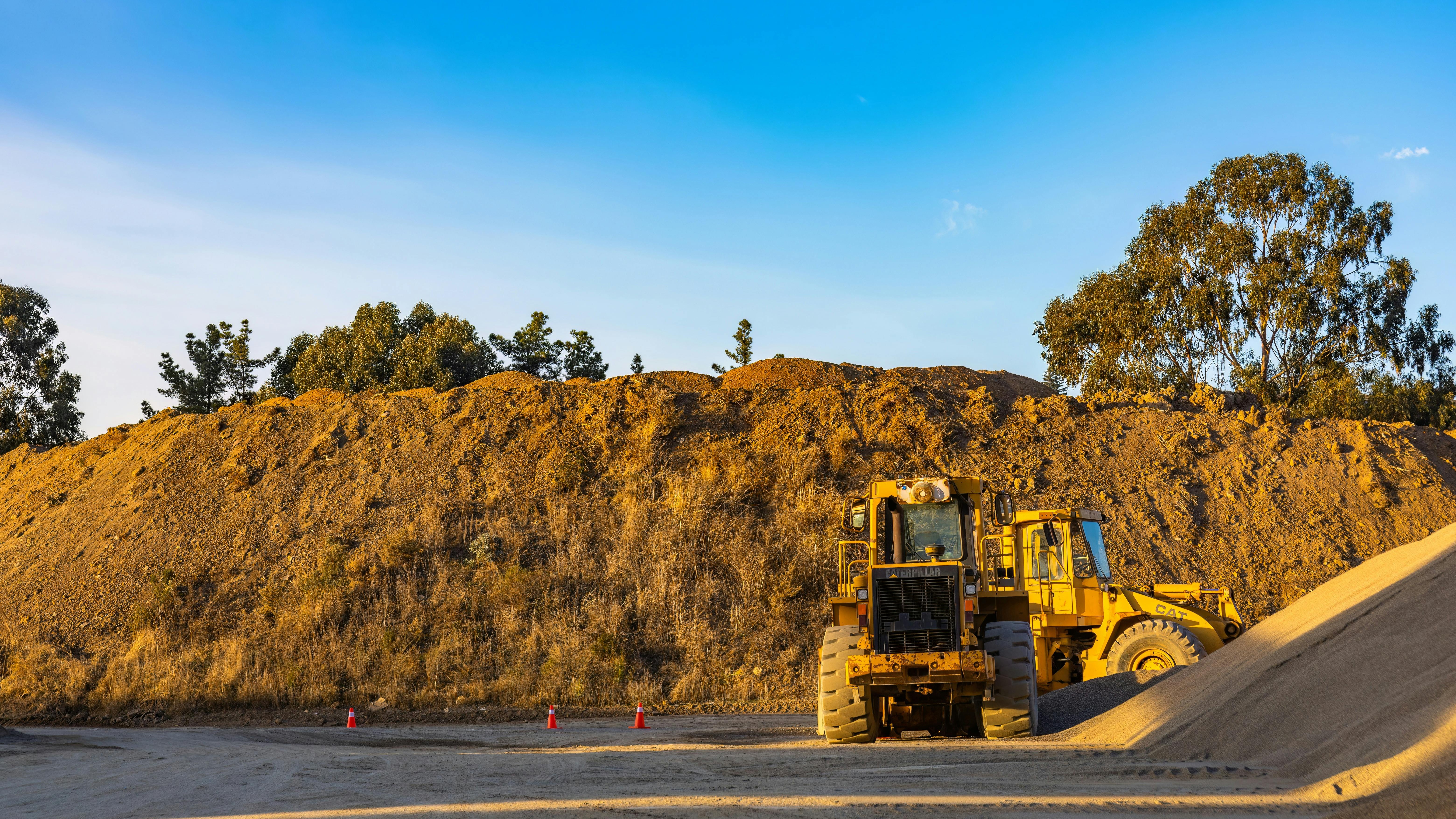 Heavy earthmoving equipment on a construction site