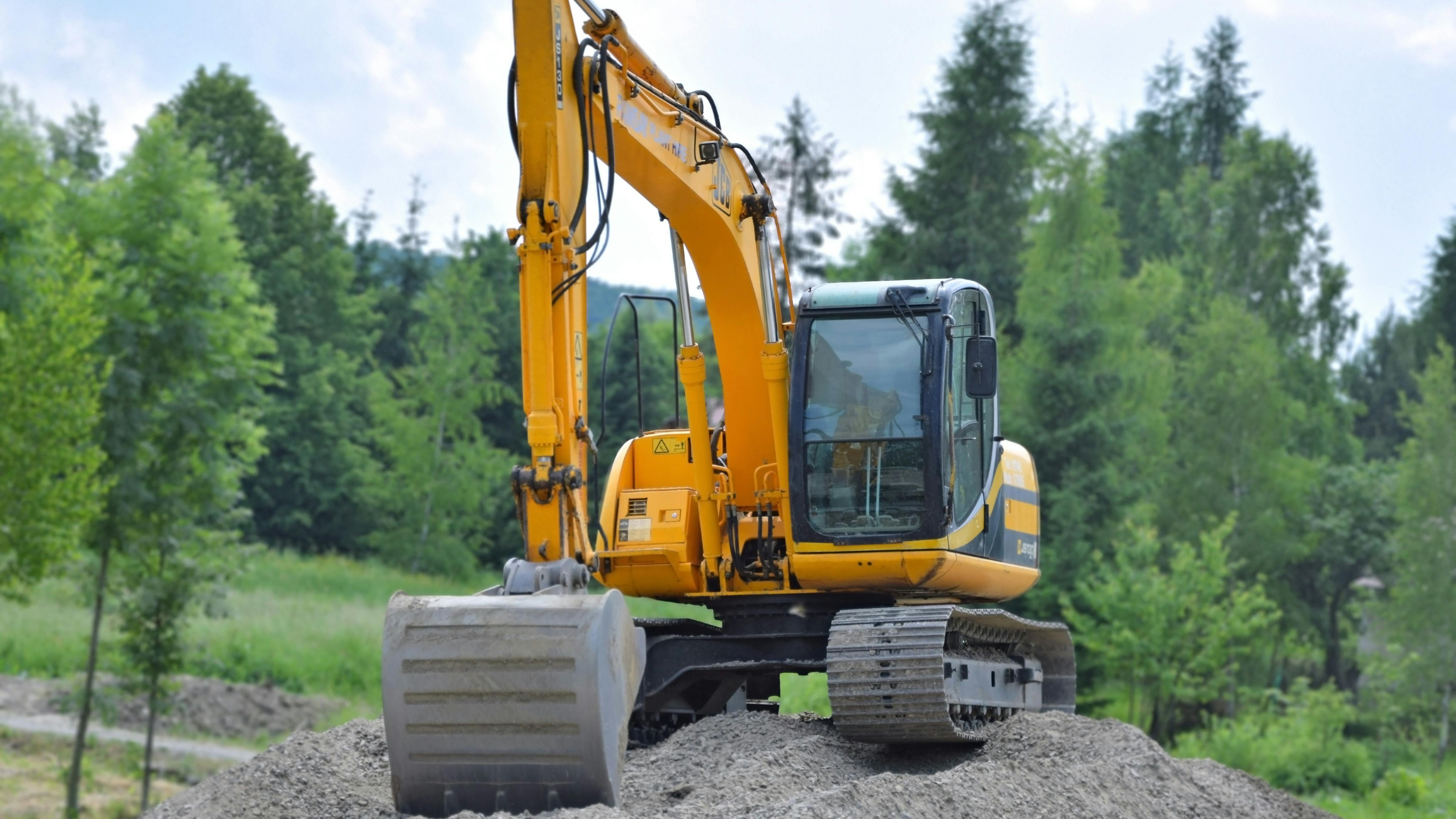 Yellow excavator digging on a construction site